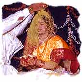 Bride throws rice on the groom's head